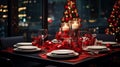 Christmas table setting with red and white plates, candles and decorations. New Yearâs Eve. Royalty Free Stock Photo