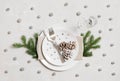 Christmas table setting with silver decorations on gray background. Top view, flat lay. New Year party Royalty Free Stock Photo