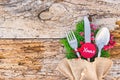 Rustic silverware for Christmas dinner, with tag xmas, and empty space for text on wood Royalty Free Stock Photo