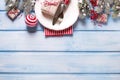 Christmas table setting. White plate, knife and fork, napkin and Royalty Free Stock Photo