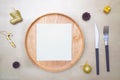 Christmas table setting. wooden plate and silverware on wooden background. Top view Royalty Free Stock Photo