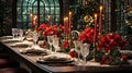 Christmas table with sparkling dinnerware and cutlery, red flowers candles decoration creating cozy festive interior atmosphere