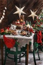 Christmas table with traditional pastries in rustic style interior Royalty Free Stock Photo