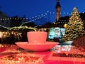 Christmas  Tallinn Cup of coffee on street cafe table top  on night  in Christmas  decoration Old Town blurred city light eve Royalty Free Stock Photo