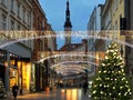 Christmas  city street  medieval houses holiday decoration city    light  lamp  blurred in shop windows street green tree decorati Royalty Free Stock Photo