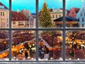 Christmas Tallinn old town hall square in windows frame green tree and famous market place in snowy Estonia holiday travel win