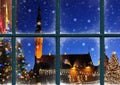 Christmas Tallinn old town hall square in windows frame green tree and famous market place in snowy Estonia holiday travel win