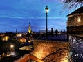 Christmas Tallinn old town panorama view from balcony at sea people relaxing on medieval city evening street with Christmas illum