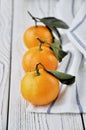 Christmas mandarins on a white wooden table