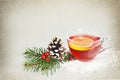 Christmas tea in transparent cup on grunge background Royalty Free Stock Photo