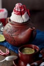 Christmas teapot with the red santa hat on it. Royalty Free Stock Photo