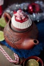 Christmas teapot with the red santa hat on it. Royalty Free Stock Photo