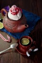 Christmas teapot with the red santa hat on it. Royalty Free Stock Photo