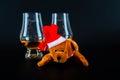 Christmas teddy bear with glass of single malt whiskey, symbol o Royalty Free Stock Photo