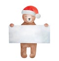 Christmas Teddy Bear wearing Santa Claus hat and holding big blank paper poster for custom text message. Royalty Free Stock Photo