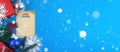 Christmas template with decorations, gifts and falling snow on a blue background, banner or layout with copy space Royalty Free Stock Photo