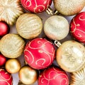 Christmas texture: red and gold glass Christmas balls on a white background. the apartment lay, top view Royalty Free Stock Photo