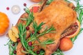 Christmas or Thanksgiving duck baked for traditional festive dinner with apples, rosemary, grapefruits on white Royalty Free Stock Photo