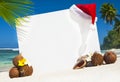 Christmas Themed Board On The Beach Royalty Free Stock Photo