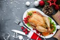 Christmas themed dinner table roasted chicken and christmas decoration Royalty Free Stock Photo