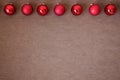 Christmas time banner template on brown background. New Year decoration. Xmas red balls. Flat-lay. New Year concept.