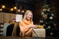 Christmas time. Celebration. Fashion portrait of girl indoors with Christmas tree. True Emotions. Happy emotion