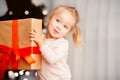 Cheerful child enjoying big Xmas gift box Royalty Free Stock Photo