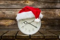 Christmas time - clock with Santa hat Royalty Free Stock Photo