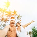 Christmas time image of Cheerful young people couple dressed re