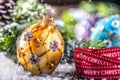 Christmas Time. Luxury golden purple blue christmas ball and decoration.Red ribbon with text happy christmas Royalty Free Stock Photo