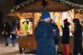 Christmas time, a man drinks hot wine in the Old Town of Tallinn at the Christmas market Royalty Free Stock Photo