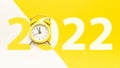 Christmas time 2022. Retro style yellow clock in happy Christmas midnight. Countdown to new year on happy xmas yellow Royalty Free Stock Photo