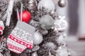 Christmas toy in the form of mittens hanging on a Christmas tree Royalty Free Stock Photo