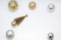 Christmas toy, a lot of brilliant balls of golden, silver color and golden tree. New Year. On a gray background Royalty Free Stock Photo