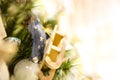 Christmas Toy old wooden sled hanging on branch Burning Candles, Boxes, Balls, Pine Cones, Walnuts, Branchesin the Royalty Free Stock Photo