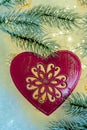 Christmas toy red heart with ornament Toned image. Copy space. Closeup. Happy Merry Christmas and New year. Royalty Free Stock Photo