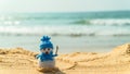 Christmas toy snowman on the beach new Year Royalty Free Stock Photo