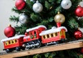 A Christmas Toy Train Under A Tree, With A Front Angle. Generative AI