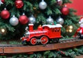 A Christmas Toy Train Under A Tree, With A Front Angle. Generative AI