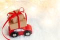 Christmas toy truck with gift boxes and pine tree on wooden table over green background Royalty Free Stock Photo