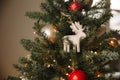 Christmas toy wooden deer on the Christmas tree