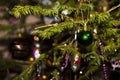 Christmas toys against the background of green branches and lights