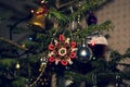 Christmas toys against the background of green branches and lights