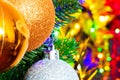 Christmas toys on the Christmas tree on the colorful lighting background. Beautiful glass Christmas decorations. Cool bright New Royalty Free Stock Photo