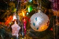 Christmas toys on christmas tree with luminous festoon closeup. New Year`s holiday background. Royalty Free Stock Photo