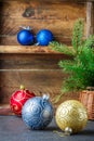 Christmas toys. Colorful balls and Christmas tree branch in basket. The vintage style Royalty Free Stock Photo