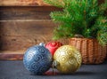 Christmas toys. Colorful balls and Christmas tree branch in basket. The vintage style Royalty Free Stock Photo