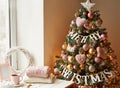 Christmas toys and decorations background. Christmas tree. Decorated New Year`s tree on blurred, sparkling and fairy background. N Royalty Free Stock Photo