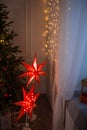 Christmas toys, garlands and interior elements in lights, home decoration for the holiday. Royalty Free Stock Photo