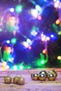 Christmas toys on wooden table against the decorated Christmas Tree. Xmas festive decorations on wood. Holiday background image Royalty Free Stock Photo